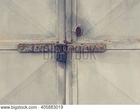 Rusty Latch And Lock Housing, Rusty Metal Door Frame. Advanced Corrosion On An Industrial Door Lock.