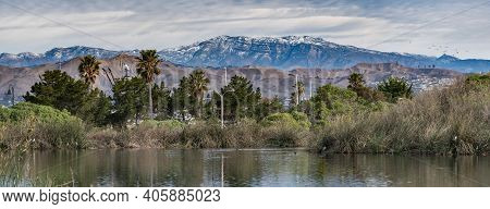Compressed Landscape View Of Coastal Esturary Pond In Foreground Looking Across Ventura To Snow Cove