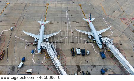Aerial View Of Regional Airport With Terminal And Airplanes, Jets Parked On Tarmac From Above, Regio