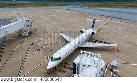 Aerial View Of Regional Airport With Terminal And Airplanes, Jets Parked On Tarmac From Above, Regio