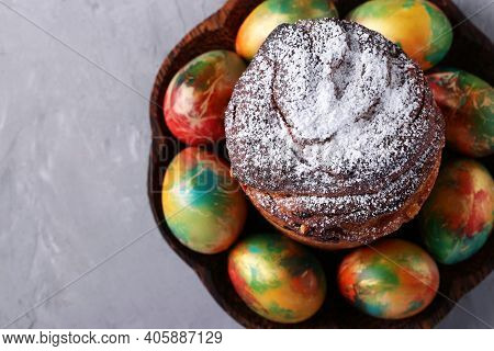 Easter Cake Craffin And Marble Colorful Eggs On Gray Background. Space For Text. Top View