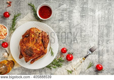 Top View Or Flat Lay Of A Tasty Juicy Whole Grilled And Roasted Chicken With Golden Brown Crust, In 