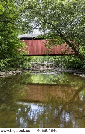 Built In 1891, The Historic Red Fletcher Covered Bridge Crosses Tenmile Creek Near Marshville In Har