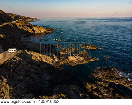 Spanish Rocky Coastline With Camper Car Camping On Cliff Sea Shore. Mediterranean Region Of Villaric