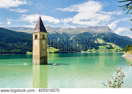The Famous Bell Tower In The Lake Of Reschen - Lago Di Resia In South Tyrol, Italy. During Ww2 A Dam