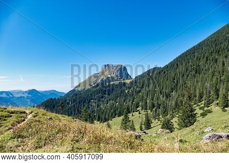 View To The Famous Mountain Red Flueh And Gimpel In The Valley From Tannheim In Austria.