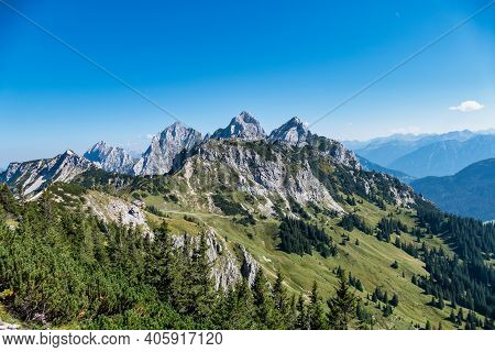 View To The Famous Mountain Red Flueh And Gimpel In The Valley From Tannheim In Austria.