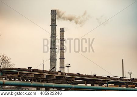 Smoke Emissions From Two Pipes Of An Industrial Enterprise. Pollution Of The Environment.