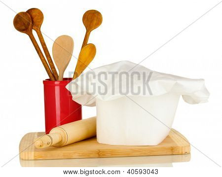 Kochmütze mit Löffel und Federballschläger, isolated on white