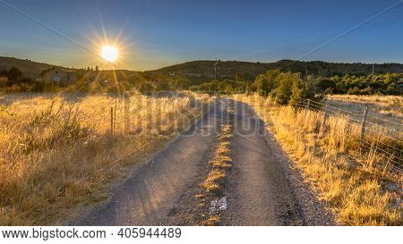Sunrise Over Road In Highland Limestone Karst Plateau Landscape On Causse De Blandas, Occitanie, Fra
