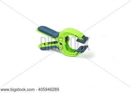 Half-open Construction Clamp On A White Background, Construction And Repair. Copy Space.