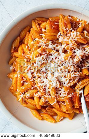 Gnocchetti Sardi Pasta In Tomato Sauce With Cheese, Gray Background. Italian Food Concept