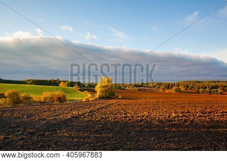 On The Empty Field After Harvesting In Summer Evening. Czech Republic. Amazing Sunset In Czech Bohem