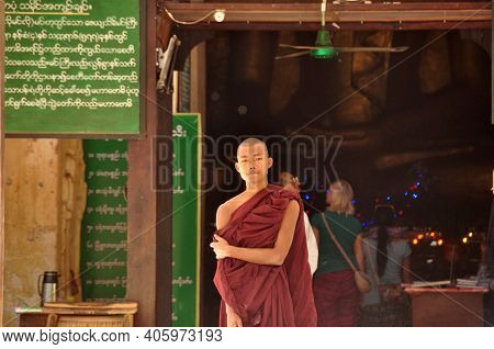 Bagan, Myanmar - Nov 13, 2015: Ethnic Monk Portrait. Young Asian Man In Robe Of Monk Standing In Fro