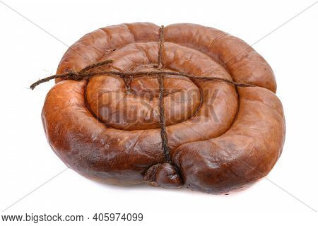 Smoked Sausage Twisted In A Spiral And Bound With A Beechnut, Isolated On A White Background.