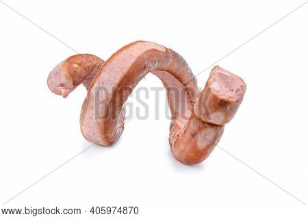 Smoked Sausage Twisted In A Spiral And Bound With A Beechnut, Isolated On A White Background.