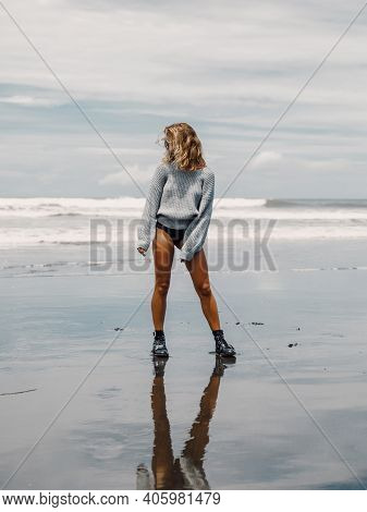 Attractive Cheerful Woman In Sweater Posing At Ocean Beach