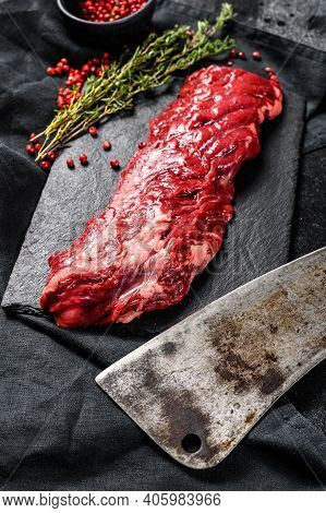 Raw Marbled Beef Steak With Pink Pepper And Thyme. Black Background. Top View