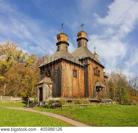 Old Wooden Church With Three Domes Built In The 19th Century, Autumn Day. Pyrohiv, Kyiv, Ukraine