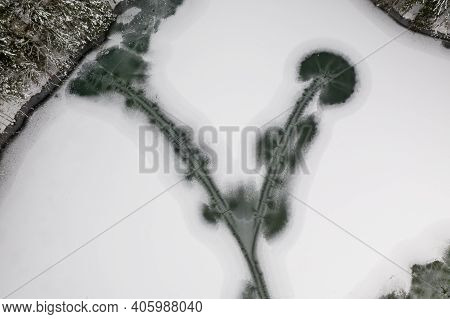 Frozen Winter Lake In The Mountains Covered With Snow. Plansar Lake, Jezersko Slovenia.