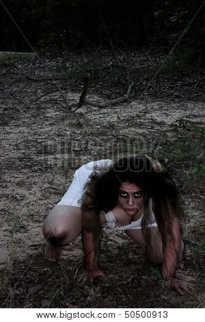 A wild woman in a forest