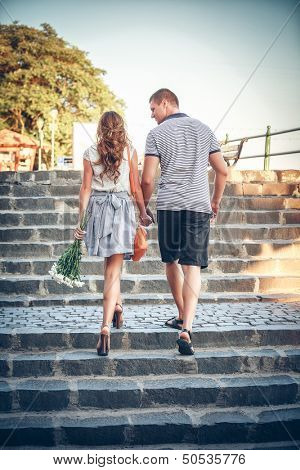 Happy lovers on romantic walk