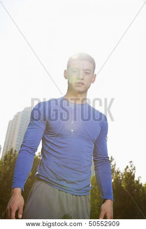 Young Athletic Man in Park, Brightly Lit