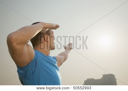 Young Muscular Man Stretching