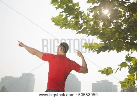 Young Muscular Man Stretching