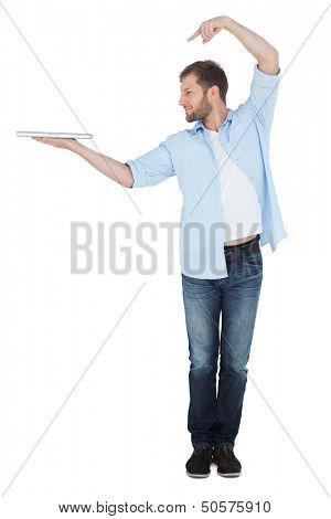 Smiling model holding laptop on right hand with flair on white background