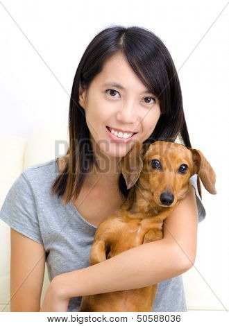 Asian woman with dachshund dog