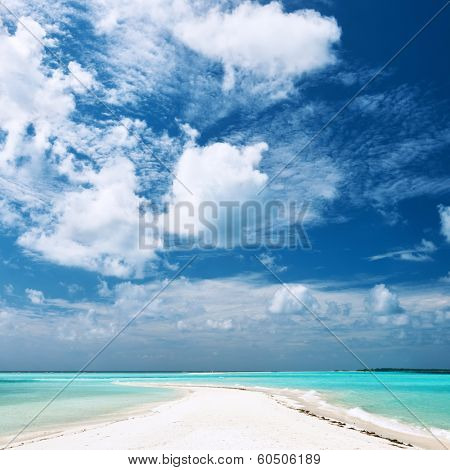 Beautiful island beach with sandspit at Maldives