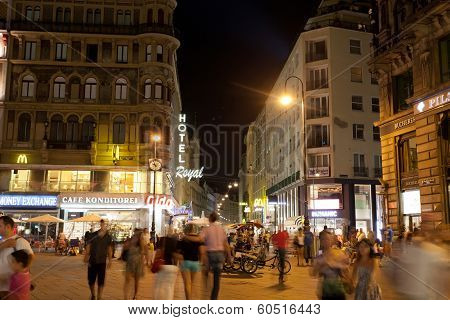 Tourists walk at night in center of Vienna