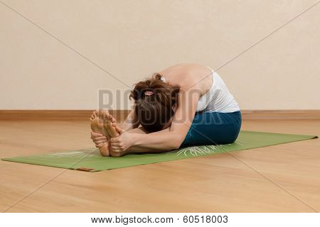 Caucasian Woman Is Practicing Yoga