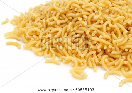a pile of uncooked macaroni on a white background