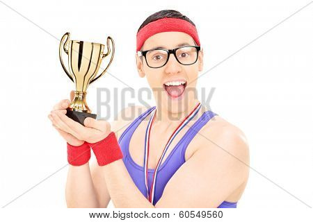 Young male champion holding a trophy isolated on white background