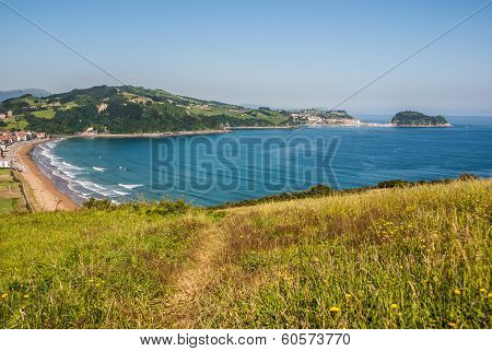 Panoramic View Of Zarautz With Guetaria On The Background On A Bright Sunny Summer Day.