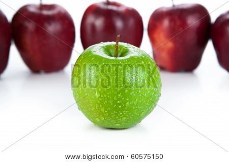Maroon Apples Lined Up In A Row And Green Apple Closeup