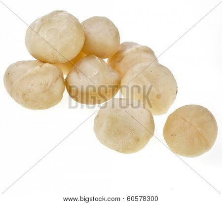 Peeled macadamia nuts isolated on white background 