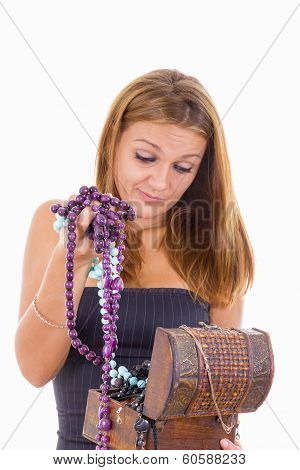 Undecided Girl Takes Out Jewelery From Jewelry Box