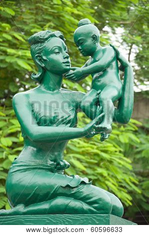 Mother And Son In The Traditional Thai Style Dress Statue
