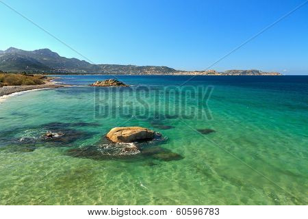 Looking Towards The Citadel Of Calvi From Rocks Near Plage De Petra Muna In Corsica