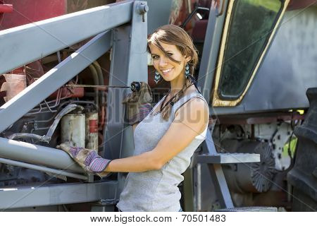 model posing as a farmers daughter in a rural environment