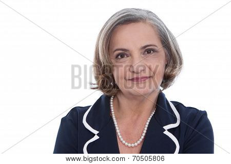Isolated Portrait Of A Satisfied Senior Female Business Woman.