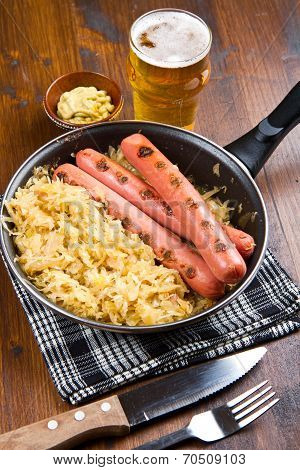 Roasted Wurstel With  Sauerkraft And Beer