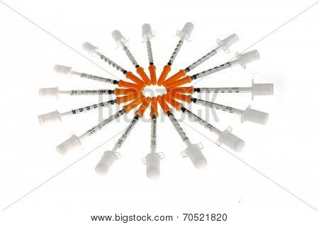 Hayward, CA - March 9, 2014: Ring of BD U-100 Insulin needles on a white background