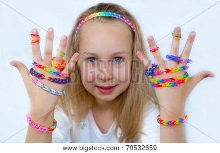 Loom bangs. Little girl demonstrated her craft work