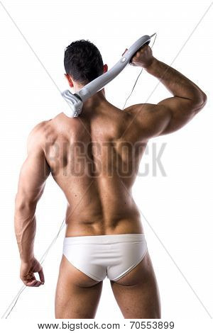 Sexy Man In White Brief Holding Massage Device