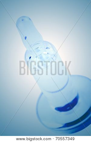 Medical Ampule On A Blue Background