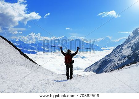 hiker at the top of a pass
